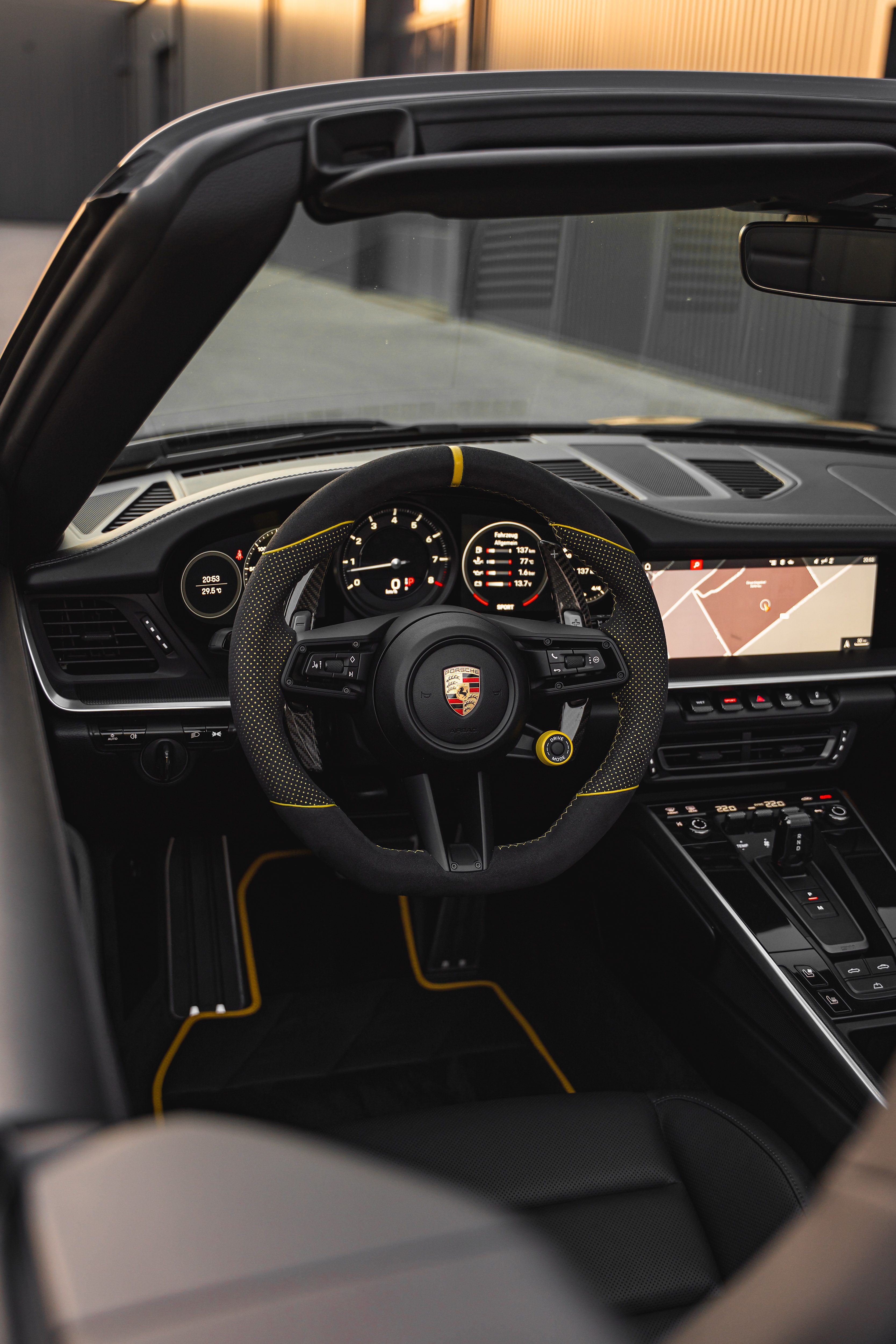 Sports car interior with yellow accents — Ultimate Garage
