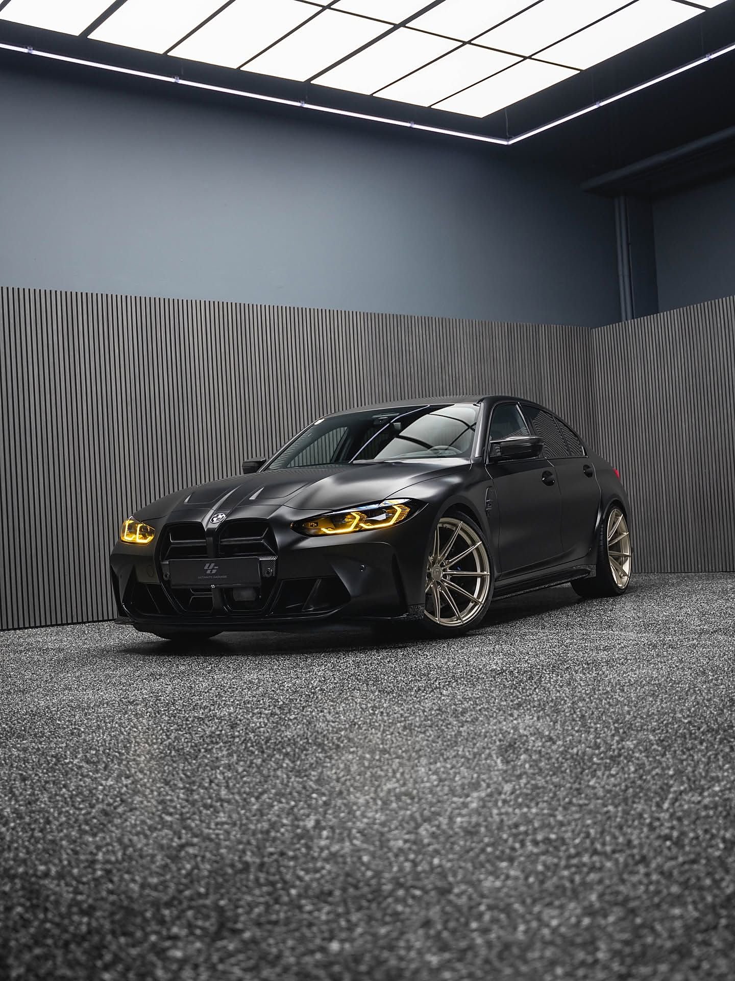 BMW M3 in gold bronze — an Ultimate Garage reference car